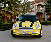 AUT 35 RK0286 01
2002 Mini Cooper Yellow And Black Head On Shot On Driveway By House