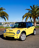 AUT 35 RK0302 01
2002 Mini Cooper S Yellow And Black 3/4 Front View On Pavement By Harbor Blue Sky