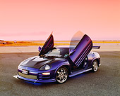 AUT 35 RK0381 01
2002 Mitsubishi Eclipse Violet Blue 3/4 Front View Doors Open On Pavement