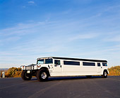 AUT 37 RK0014 02
2000 Hummer Stretched Limousine White 22 Pax 3/4 Low Side View On Pavement Blue Sky
