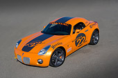 AUT 40 RK0249 01
2005 Pontiac Solstice Orange Overhead 3/4 Front View On Pavement