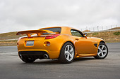AUT 41 RK0545 01
2006 Pontiac Solstice Weekend Club Racer Orange Low 3/4 Rear View On Pavement