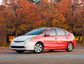 AUT 42 RK0284 01
2007 Toyota Prius White And Red On Pavement By Autumn Trees And Building