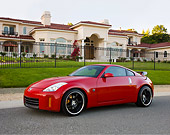 AUT 43 RK0315 01
2008 Nissan 350Z Red 3/4 Front View On Pavement By House