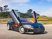 AUT 44 RK0104 01
2009 Spyker C8 Aileron Gray 3/4 Front View On Pavement By Field And Trees