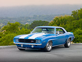 CAM 01 RK0200 01
1969 Chevrolet Camaro Z-28 Blue With White Stripe 3/4 Front View On Pavement By Trees And Fog