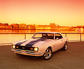 CAM 02 RK0046 01
1968 Chevrolet Camaro SS White With Blue Stripes 3/4 Front View On Pavement By Water Filtered