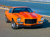 CAM 04 RK0146 01
1970 Chevrolet Camaro Orange With Red Stripes 3/4 Front View On Pavement By Water