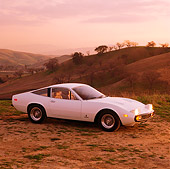 FRR 04 RK0075 02
1971 Ferrari 365 GTC/4 White On Dirt By Grass Hills In Background