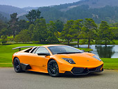 LAM 01 BK0010 01
2010 Lamborghini Murci�lago LP670-4 SV Orange 3/4 Front View On Pavement By Hills