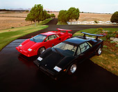 LAM 01 RK0057 01
1989  Lamborghini  Countach Red And Black Overhead 3/4 Front On Pavement And Grass