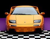 LAM 02 RK0144 02
2001 Lamborghini Diablo 6L Orange Head On Shot On Checkered And Purple Floor Studio
