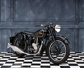 MOT 01 RK0327 05
1947 Velocette MSS Black 3/4 Front View On Checkered Floor Gray Marble Background