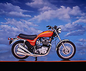 MOT 01 RK0331 06
1973 Triumph Hurricane Orange Profile On Orange Line Cloudy Blue Sky Background