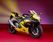 MOT 02 RK0230 06
2005 Suzuki GSXR 1000 Black And Yellow 3/4 Side View On Red Floor Yellow Purple Lights Studio