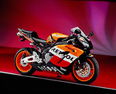 MOT 02 RK0242 16
2005 Honda CBR 1000RR Repsol Orange And Red 3/4 Side View On Red Floor Gray Line Studio