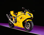 MOT 02 RK0267 07
2005 Triumph Daytona 650 Yellow 3/4 Front View On Purple Floor Studio