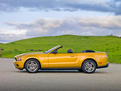 MST 01 RK1238 01
2010 Ford Mustang Gold Profile On Pavement By Grassy Hills