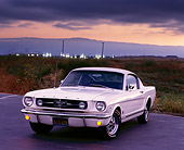 MST 01 RK0120 01
1965 Ford GT Mustang Fastback White 3/4 Front On Pavement Parking Lights On Gray Cloudy Skies