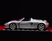 POR 04 RK0572 03
2004 Porsche Carrera GT Silver Profile On Checkered Line Red Floor Studio