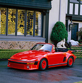 POR 04 RK0410 02
1988 Porsche Convertible Custom Red 3/4 Front View On Driveway By House