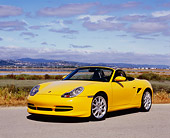 POR 04 RK0641 01
2000 Porsche Boxster Yellow Front 3/4 View On Pavement By Marsh