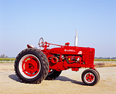 TRA 01 RK0092 03
1954 Farmall Super MTA Red Tractor 3/4 Side View On Dirt Blue Sky