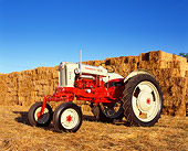 TRA 01 RK0119 02
1957 Ford Powermaster 950 Red And Gray 3/4 Side View By Hay Stacks
