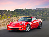 VET 01 RK0929 01
2010 Chevrolet Corvette Grand Sport Red 3/4 Front View On Pavement By Trees