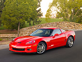 VET 01 RK0930 01
2010 Chevrolet Corvette Grand Sport Red 3/4 Front View On Pavement By Trees