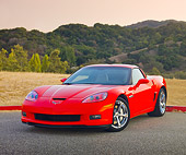 VET 01 RK0931 01
2010 Chevrolet Corvette Grand Sport Red 3/4 Front View On Pavement By Hills