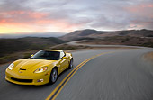 VET 01 RK0905 01
2009 Chevrolet Corvette Z06 Yellow Driving On Highway At Dusk