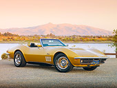 VET 03 RK0655 01
1969 Chevrolet Corvette 427 Convertible Gold 3/4 Front View On Pavement By Lake
