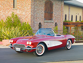 VET 03 RK0665 01
1961 Chevrolet Corvette Convertible Maroon And White 3/4 Front View On Pavement By Brick Building