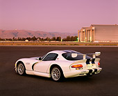 VIP 01 RK0159 01
1998 Viper GT2 White With Blue Stripes 3/4 Rear View On Pavement By Airplane Hanger Purple Sky