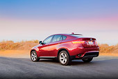 AUT 01 BK0003 01
2010 BMW X6 Sports Activity Vehicle Red 3/4 Rear View On Pavement