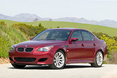 AUT 01 RK0241 01
2006 BMW M5 Burgundy 3/4 Front View On Pavement By Hills