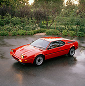 AUT 01 RK0009 08
1988 BMW M1 Red Overhead Side 3/4 View On Wet Pavement By Trees