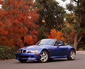 AUT 01 RK0035 02
1999 BMW M Roadster Z3 Convertible Blue Low 3/4 Front View On Pavement By Fall Colored Trees
