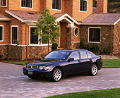 AUT 01 RK0132 01
2002 BMW 745i Blue 3/4 Side View On Driveway By House