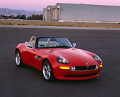 AUT 01 RK0143 02
2001 BMW Z8 Convertible Red Front 3/4 View On Pavement By Hangar
