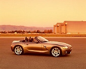AUT 01 RK0159 03
2003 BMW Z4 3.0i Convertible Gray 3/4 Front View On Pavement By Hangar