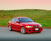 AUT 01 RK0177 01
2003 BMW 330i Sport Sedan Red 3/4 Front View On Pavement By Grass Hill Filtered