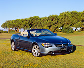 AUT 01 RK0205 02
2005 BMW 645Ci Convertible Blue 3/4 Front View On Grass Trees Background
