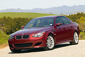 AUT 01 RK0243 01
2006 BMW M5 Burgundy 3/4 Front View On Pavement By Hills