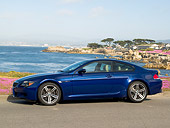 AUT 01 RK0267 01
2006 BMW M6 Coupe Blue 3/4 Side View On Pavement