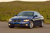 AUT 01 RK0287 01
2007 BMW 335i Coupe Blue 3/4 Front View On Pavement By Hills