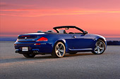 AUT 01 RK0291 01
2007 BMW M6 Convertible Blue 3/4 Rear View On Pavement By Grass Hills