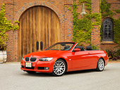 AUT 01 RK0298 01
2007 BMW 328Ci Convertible Red Low 3/4 Side View On Pavement