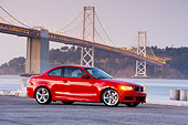 AUT 01 RK0325 01
2008 BMW 135i Red 3/4 Front View By Bridge